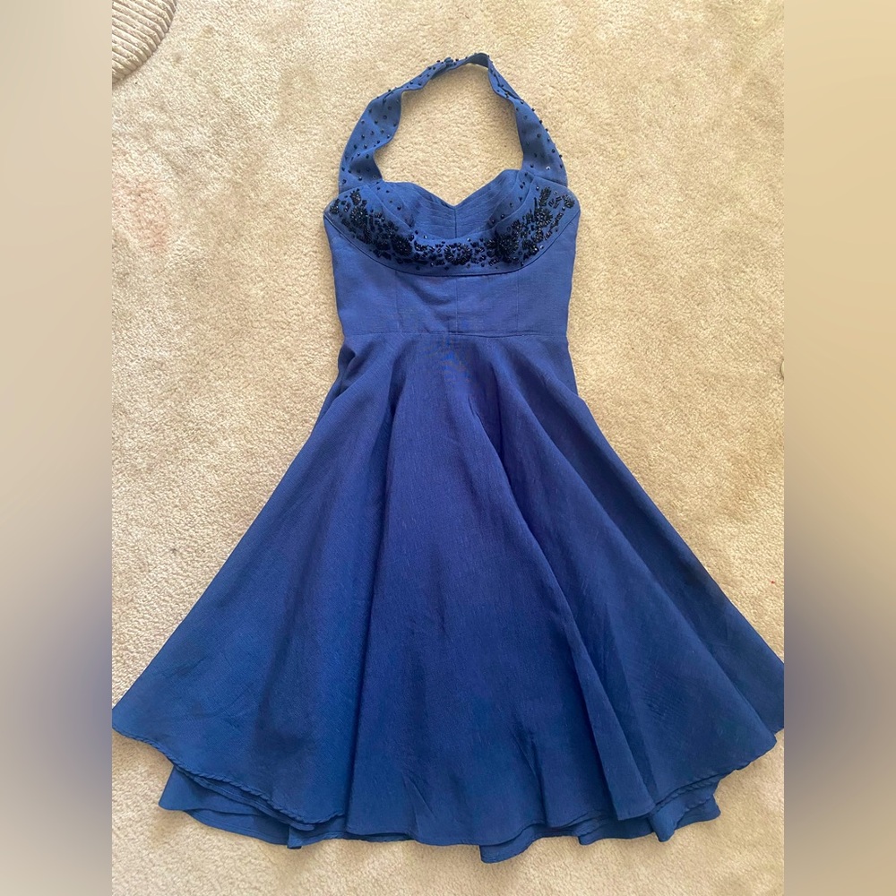 True vintage fit and flare halter dress with sequin embellishment. Midnight Blue
